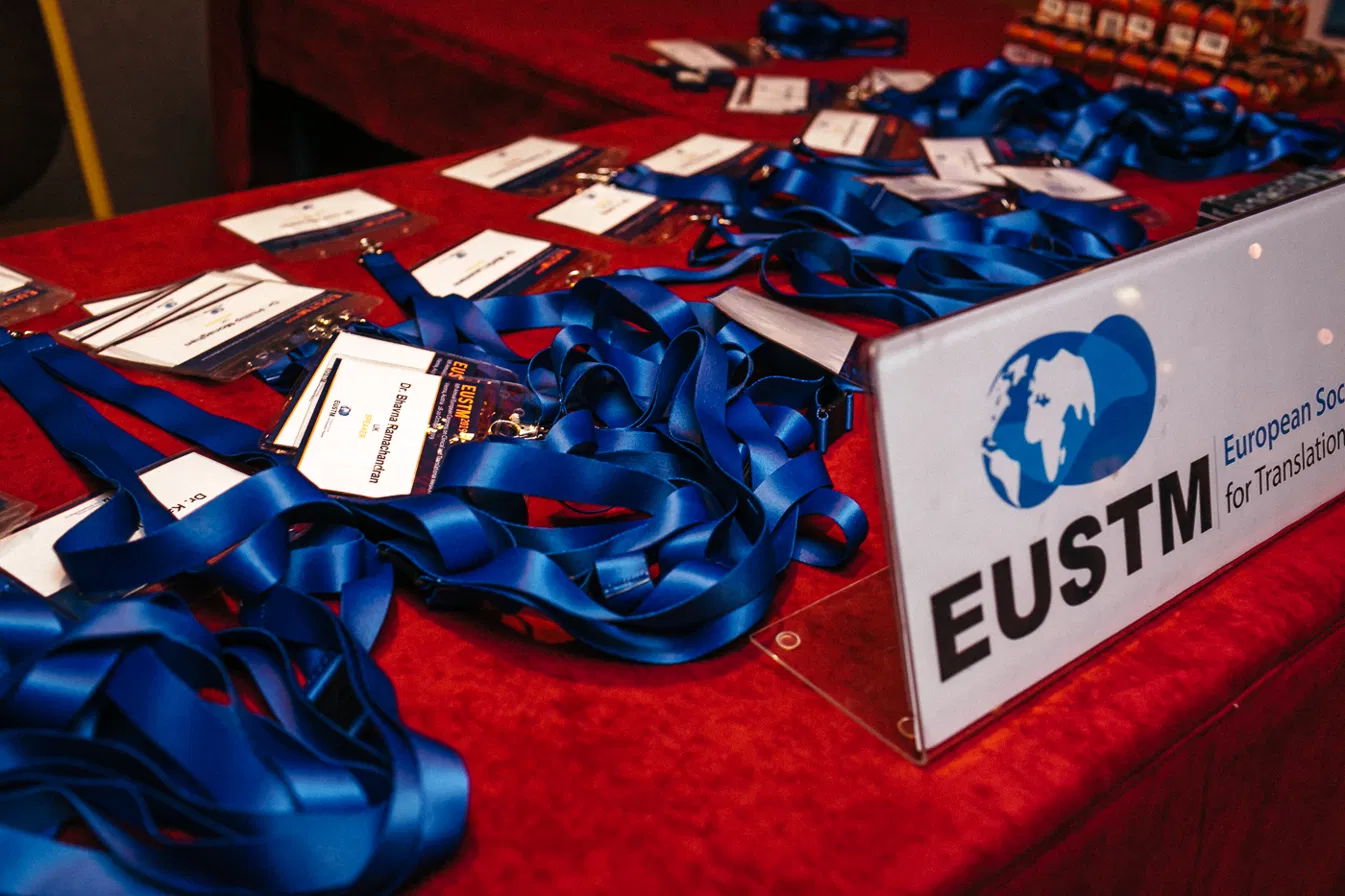 Registration desk with delegate badges and lanyards